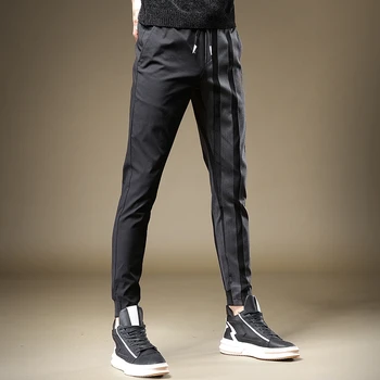 Envío libre Nuevos hombres de los hombres de negro de la moda de empalme de Alta gama casual pantalones de corte ajustado pantalones otoño coreano guapo pantalones
