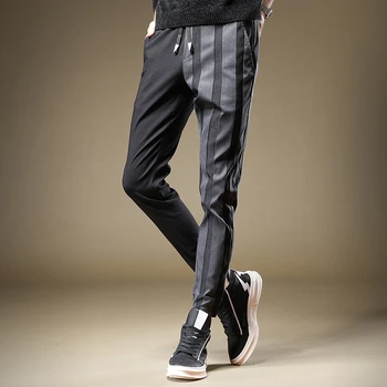 Envío libre Nuevos hombres de los hombres de negro de la moda de empalme de Alta gama casual pantalones de corte ajustado pantalones otoño coreano guapo pantalones