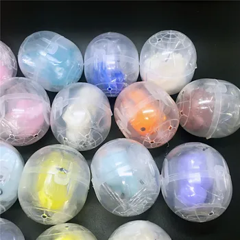 10pc/lot 47*55mm de diámetro de plástico, bolas de colores de las cápsulas de juguetes con el interior de mini muñecas juguetes combinar al azar de máquina expendedora