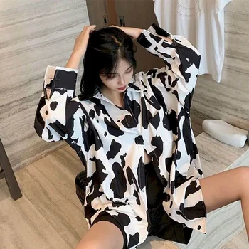 En blanco y negro de manga larga blusa de mujer de diseño de sentido nicho de la solapa de otoño nuevo coreano flojo vaca patrón femenino de la chaqueta de la camisa de fuego